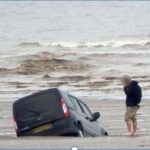 Cartoon car sinking underwater with technology components floating around